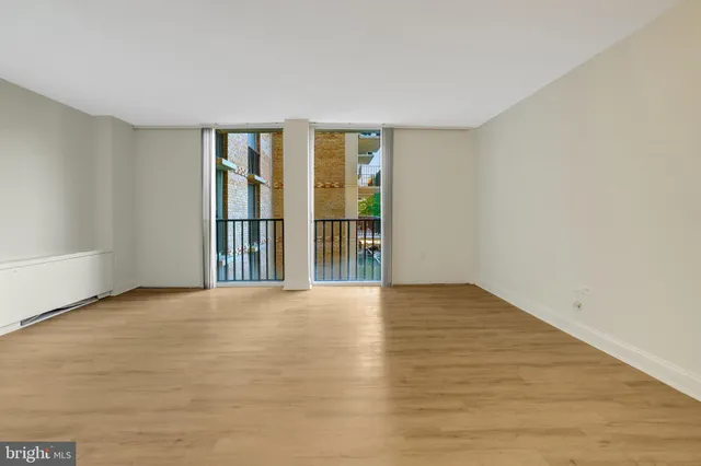 a bathroom with a sink a toilet a mirror and shower