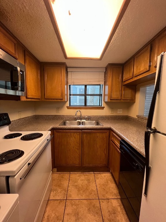 3506 Speedway, Unit 101 Austin, TX 78705 - Photo 20 of 31 a kitchen with stainless steel appliances granite countertop a sink stove and cabinets