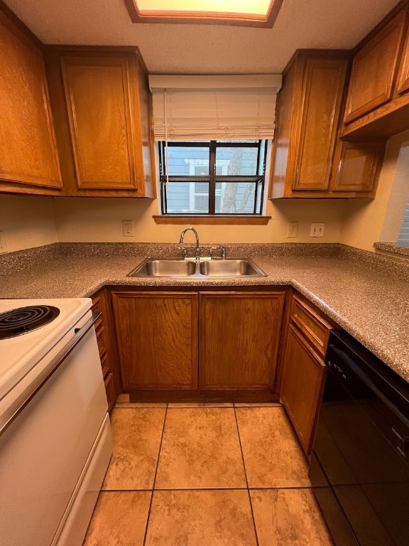 3506 Speedway, Unit 101 Austin, TX 78705 - Photo 22 of 31 a kitchen with a sink a stove top oven and cabinetry