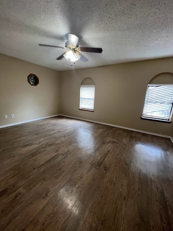 3506 Speedway, Unit 101 Austin, TX 78705 - Photo 25 of 31 an empty room with wooden floor chandelier fan and windows