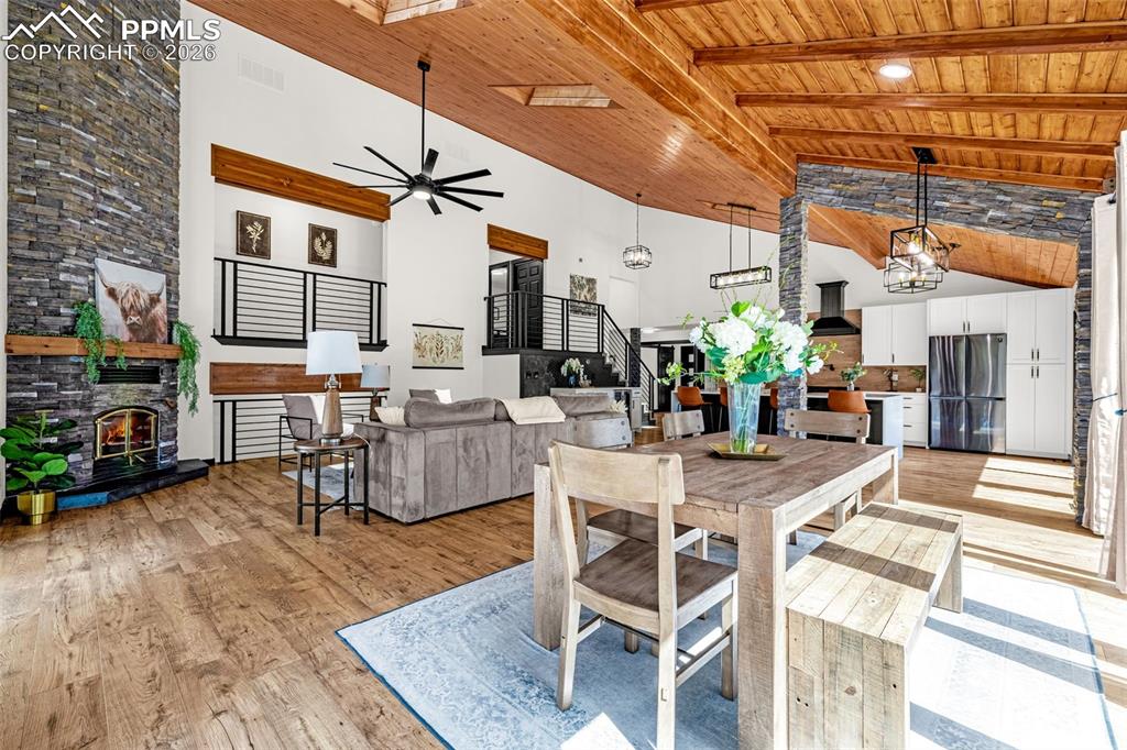 15520 Bar X Road Colorado Springs, CO 80908 - Photo 16 of 50 a dining room with furniture and wooden floor