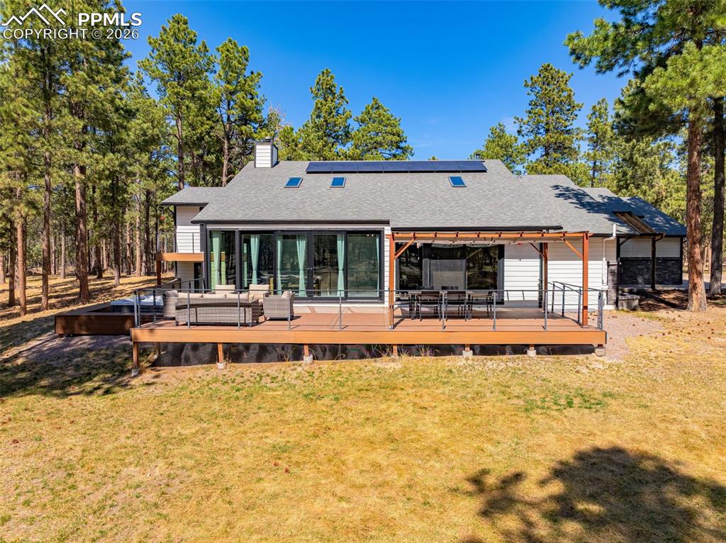 15520 Bar X Road Colorado Springs, CO 80908 - Photo 2 of 50 a house view with sitting space and garden space