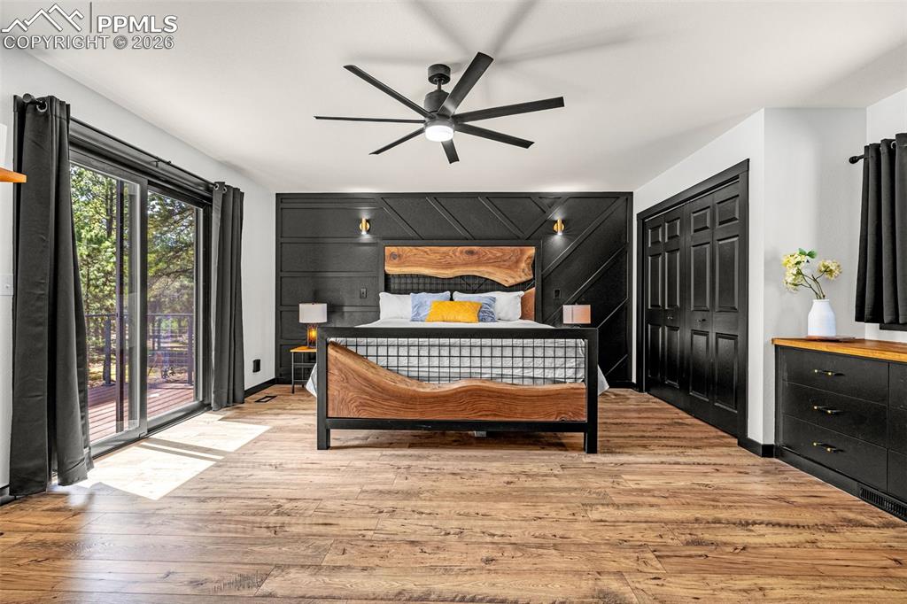 15520 Bar X Road Colorado Springs, CO 80908 - Photo 22 of 50 a bedroom with a bed and a window