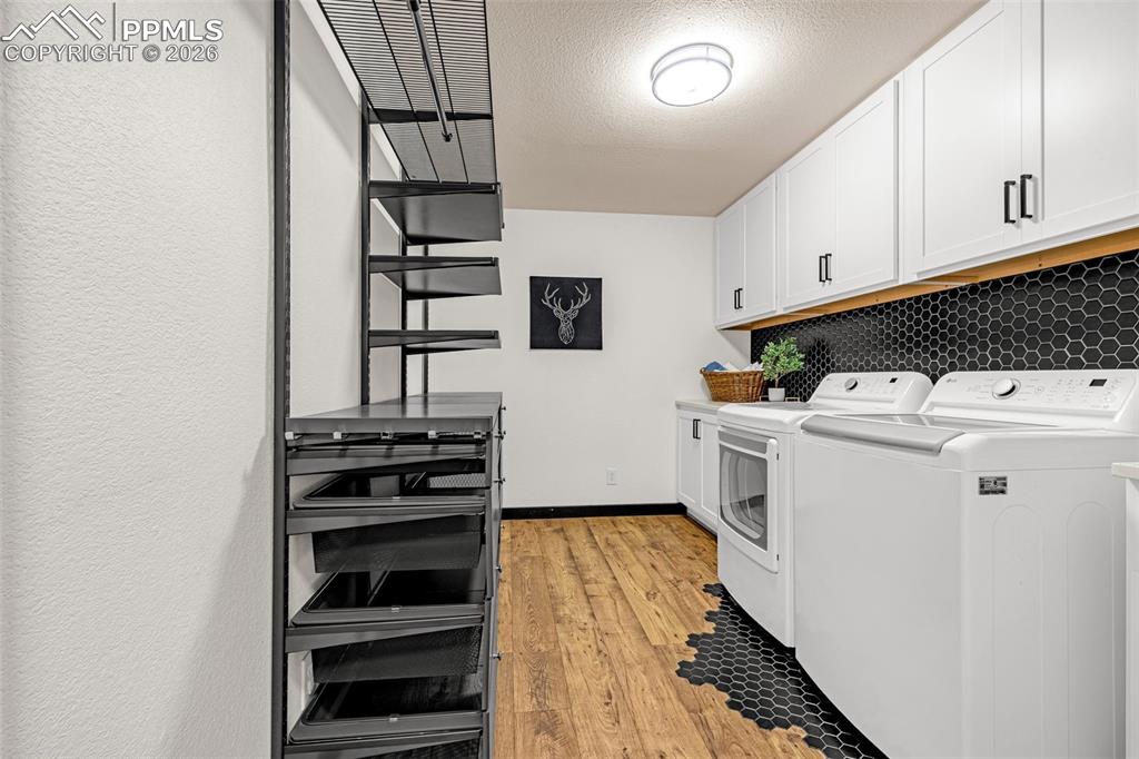 15520 Bar X Road Colorado Springs, CO 80908 - Photo 30 of 50 a utility room with washer and dryer