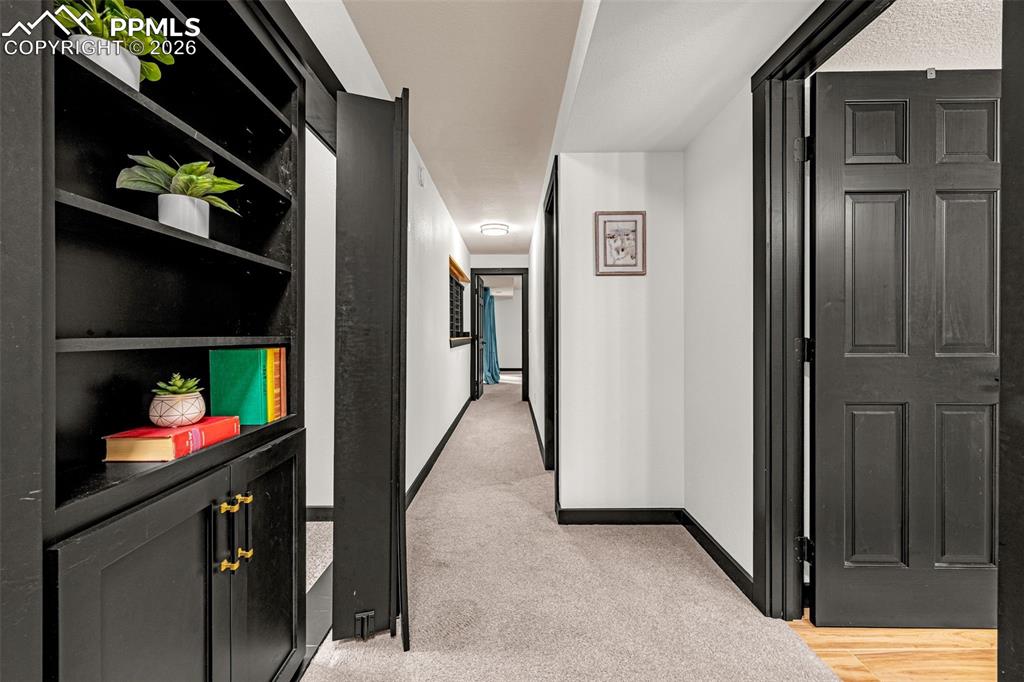 15520 Bar X Road Colorado Springs, CO 80908 - Photo 32 of 50 a view of an entryway with a hallway