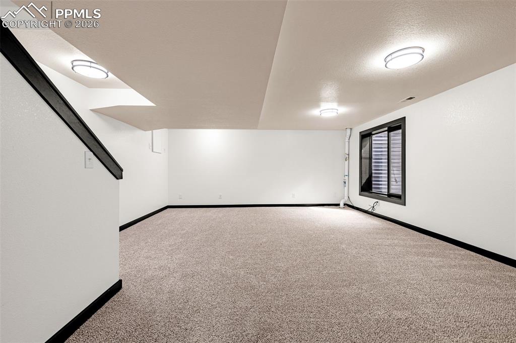 15520 Bar X Road Colorado Springs, CO 80908 - Photo 36 of 50 a view of an empty room with a window