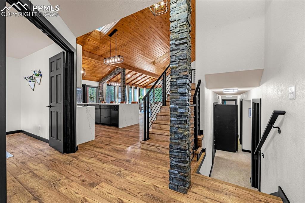 15520 Bar X Road Colorado Springs, CO 80908 - Photo 4 of 50 a view of entryway and hall with wooden floor