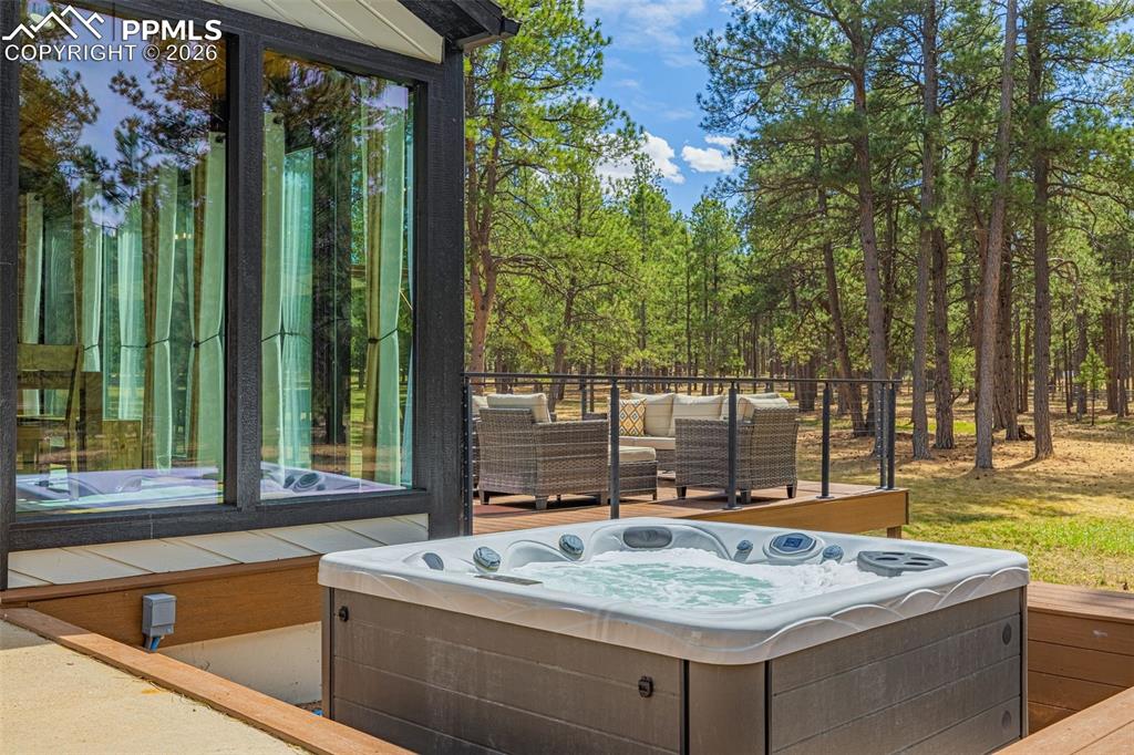 15520 Bar X Road Colorado Springs, CO 80908 - Photo 43 of 50 a view of a kitchen with a sink and large trees