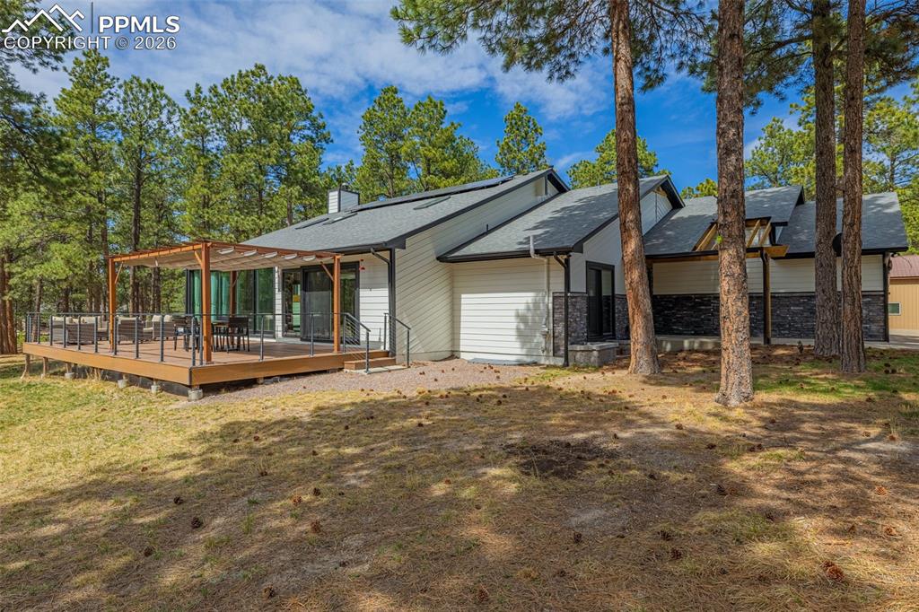 15520 Bar X Road Colorado Springs, CO 80908 - Photo 46 of 50 front view of a house with a yard