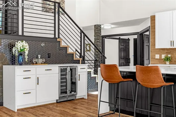 a dinning table and chairs in the kitchen