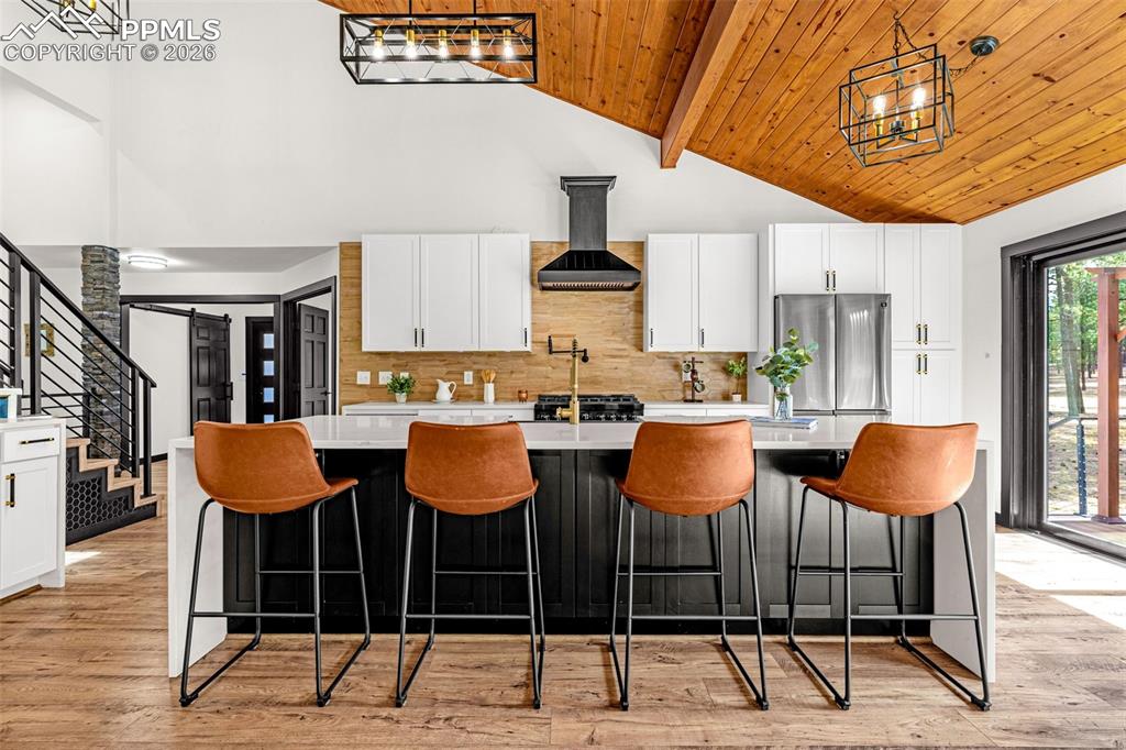 15520 Bar X Road Colorado Springs, CO 80908 - Photo 6 of 50 a dinning table and chairs in the kitchen