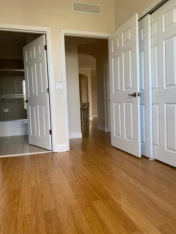 a view of an entryway with wooden floor