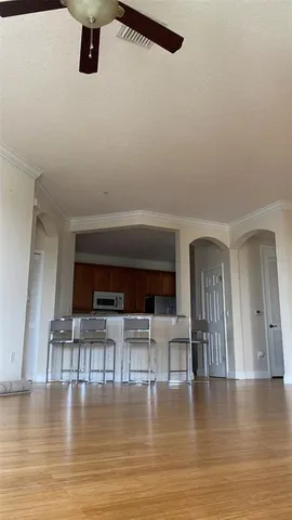 a view of livingroom with dining room and hardwood floor