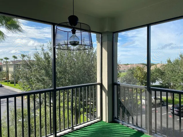a view of a balcony with furniture