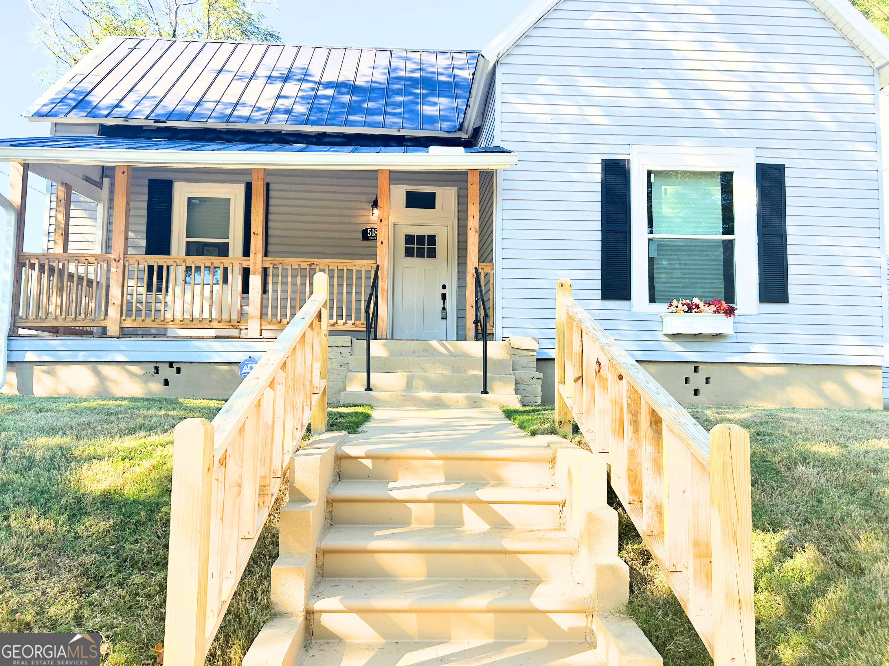 518 East Furlow Street Americus, GA 31709 - Photo 3 of 28 a view of a house with a swimming pool and sitting area