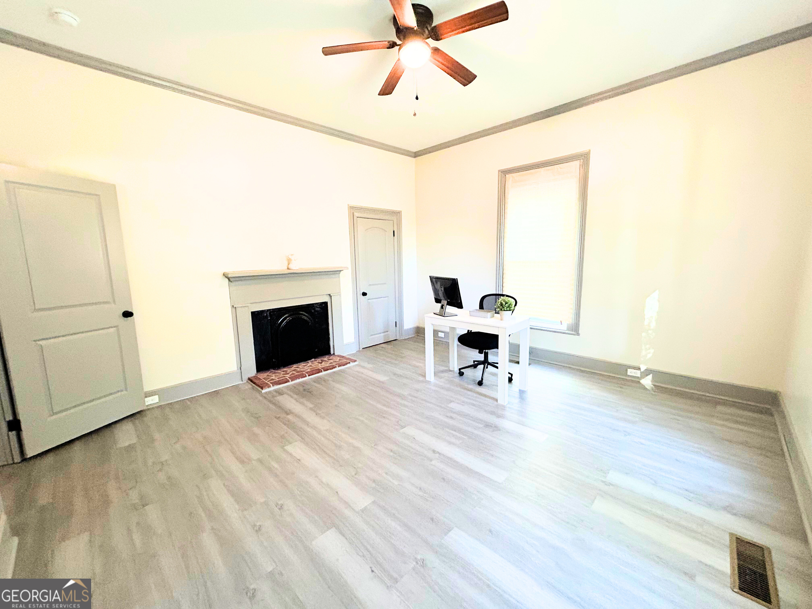 518 East Furlow Street Americus, GA 31709 - Photo 9 of 28 a living room with furniture and a fireplace