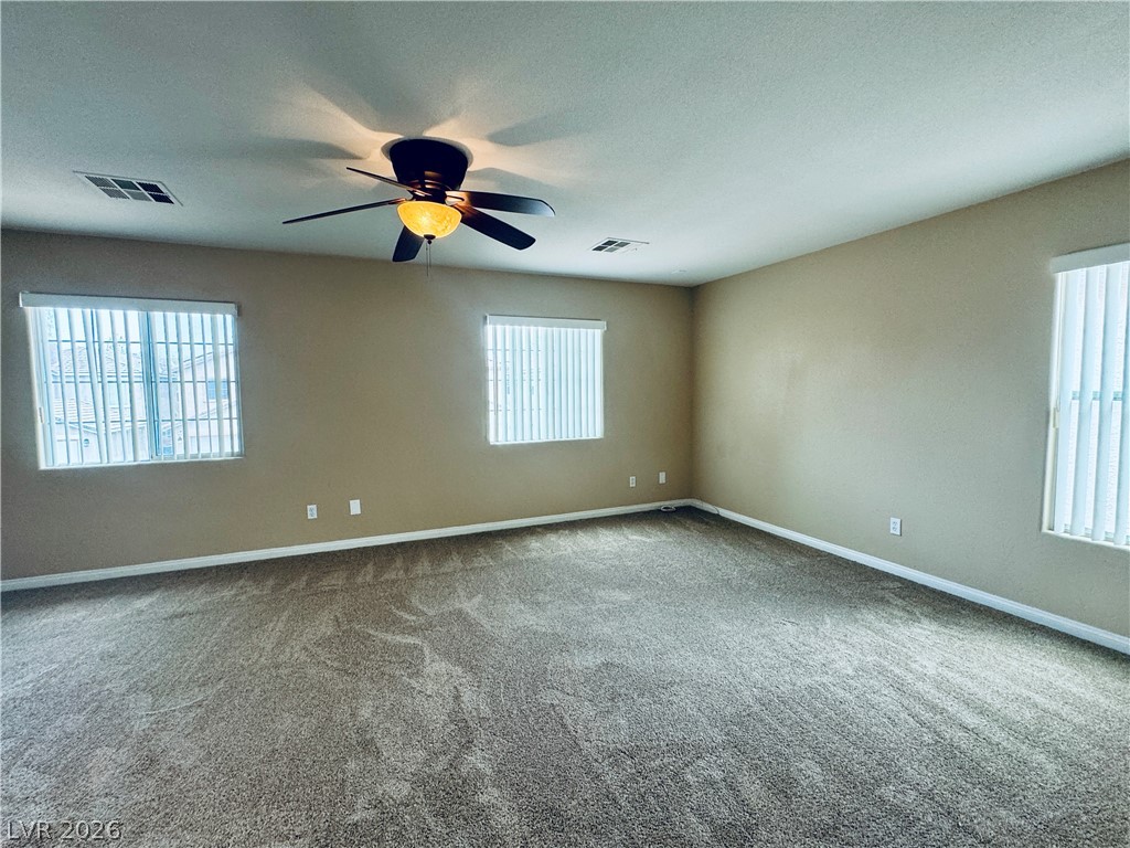 8617 Palomino Ranch Street Las Vegas, NV 89131 - Photo 14 of 27 Ample space for relaxation with soft carpeting and overhead illumination.