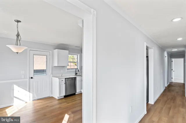 a kitchen with stainless steel appliances a refrigerator and a stove top oven