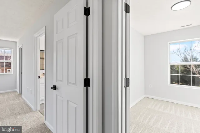 a view of a room with white walls