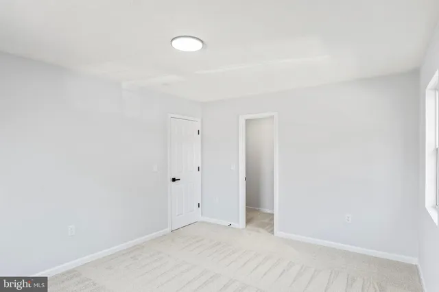 a front view of a house with a iron gate