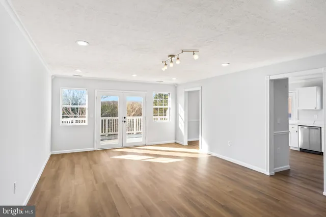 a view of a kitchen with a refrigerator a sink and dishwasher