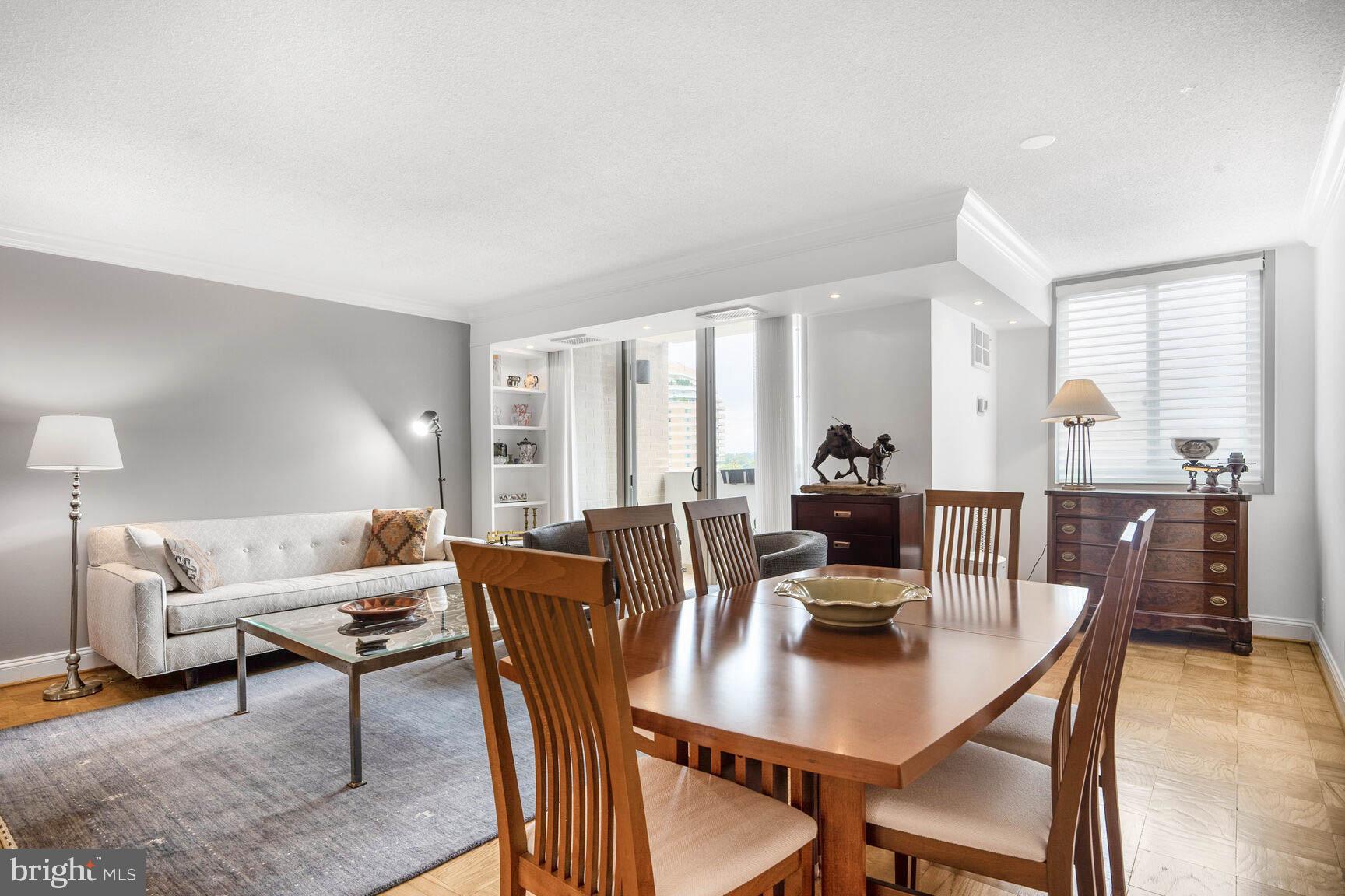 4601 North Park Avenue, Unit 1118 Chevy Chase, MD 20815 - Photo 7 of 30 a view of a dining room with furniture
