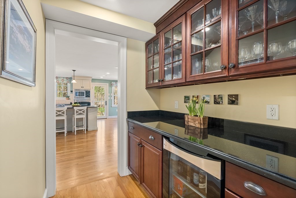 10 Meadowbrook Road Wellesley, MA 02481 - Photo 11 of 40 a kitchen with stainless steel appliances granite countertop a sink and a stove next to a large window