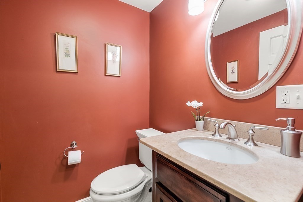 10 Meadowbrook Road Wellesley, MA 02481 - Photo 19 of 40 a bathroom with a granite countertop toilet sink and mirror