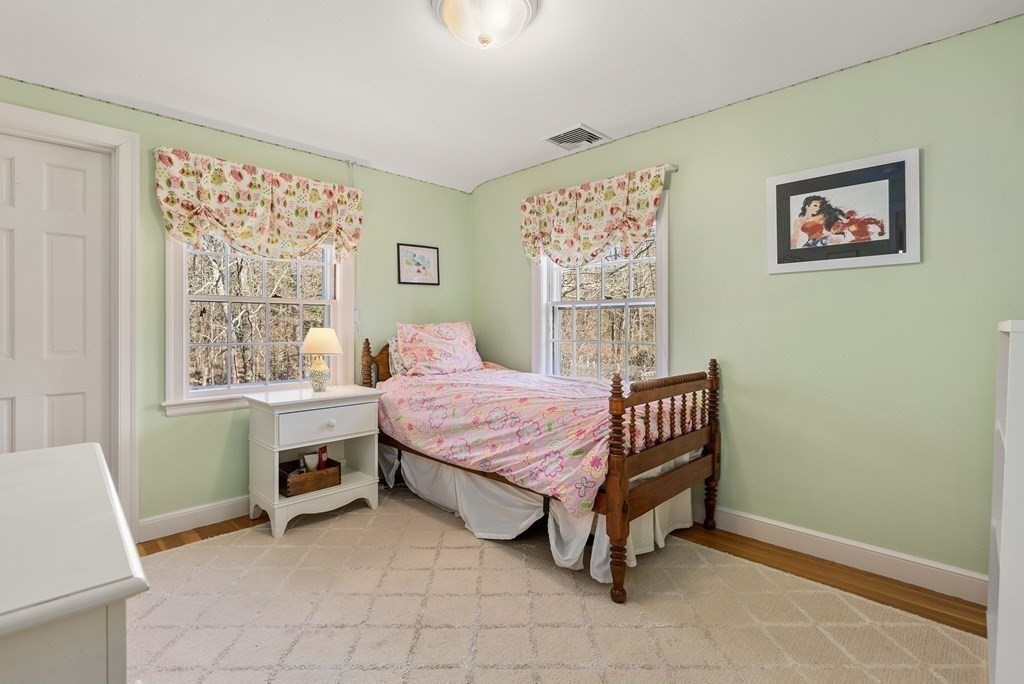 10 Meadowbrook Road Wellesley, MA 02481 - Photo 26 of 40 a bedroom with a bed and a window