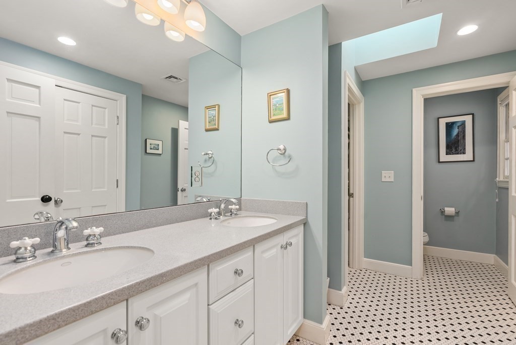 10 Meadowbrook Road Wellesley, MA 02481 - Photo 27 of 40 a bathroom with a sink a shower and a mirror