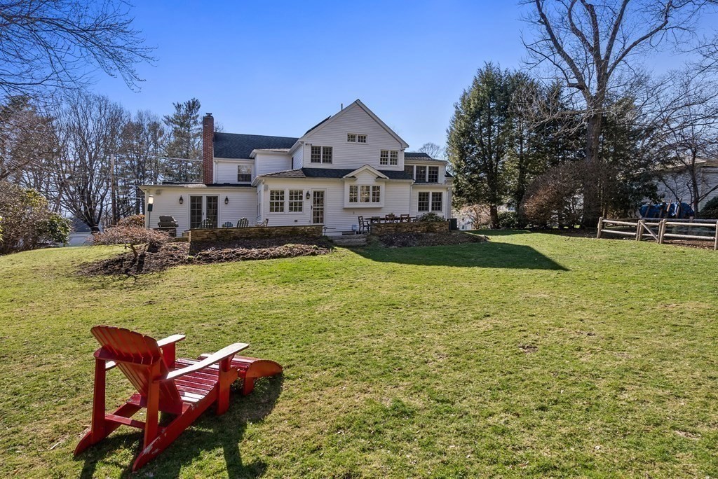 10 Meadowbrook Road Wellesley, MA 02481 - Photo 37 of 40 a front view of a house with swimming pool garden and outdoor seating