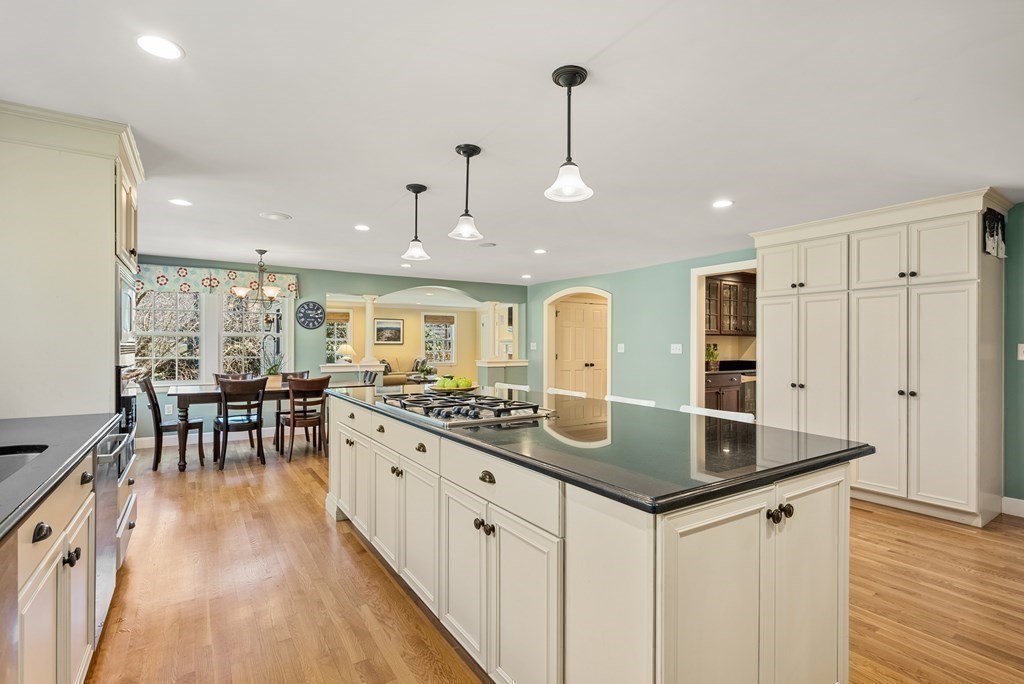10 Meadowbrook Road Wellesley, MA 02481 - Photo 9 of 40 a kitchen with stainless steel appliances granite countertop a sink and a table