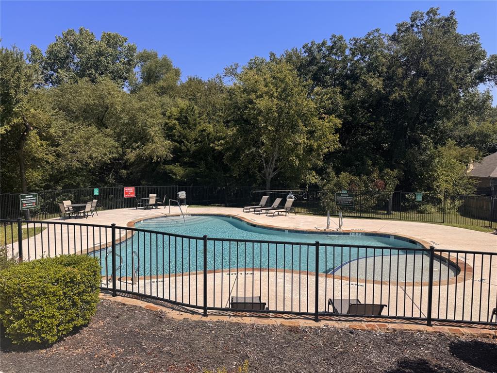 308 Sheridan Road Oak Point, TX 75068 - Photo 28 of 32 Community pool featuring a patio area