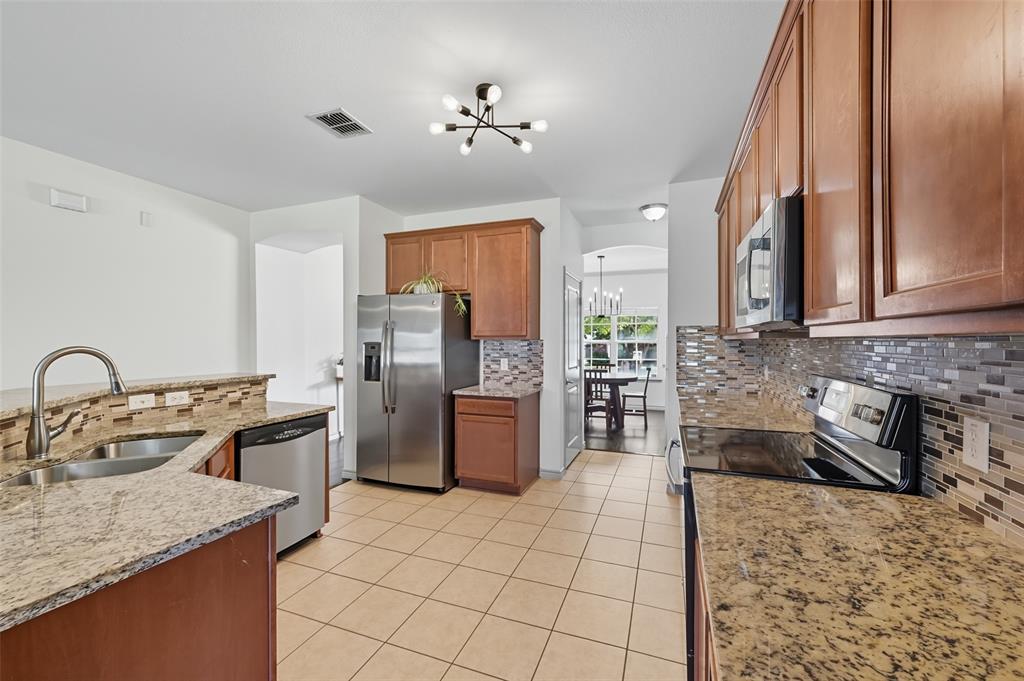 308 Sheridan Road Oak Point, TX 75068 - Photo 6 of 32 Kitchen featuring stainless steel appliances
