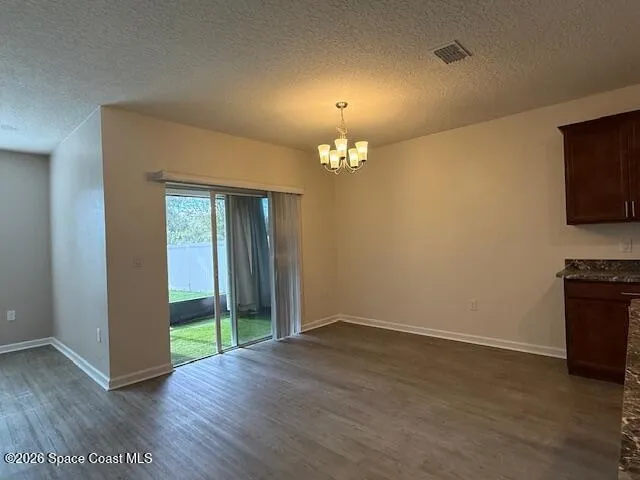 a view of kitchen with kitchen island stainless steel appliances counter space
