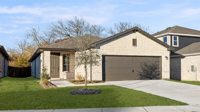 a kitchen with a sink appliances and cabinets
