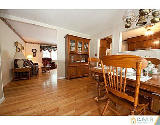 29 Orchard Road Middlesex, NJ 08846 - Photo 12 of 25 a living room with furniture and wooden floor