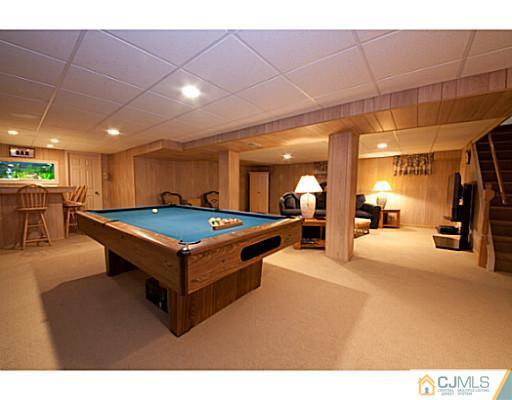 29 Orchard Road Middlesex, NJ 08846 - Photo 13 of 25 a room with pool table and a chandelier