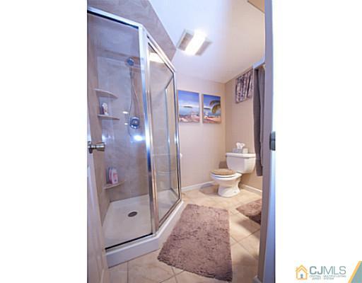 29 Orchard Road Middlesex, NJ 08846 - Photo 15 of 25 a bathroom with a shower and a toilet