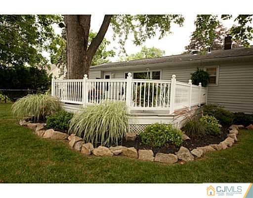 29 Orchard Road Middlesex, NJ 08846 - Photo 20 of 25 a front view of a house with a yard