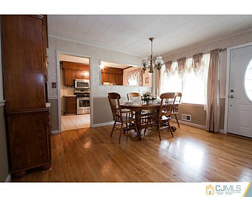 29 Orchard Road Middlesex, NJ 08846 - Photo 3 of 25 a view of a dining room with furniture window and wooden floor