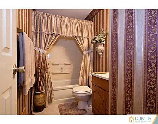 29 Orchard Road Middlesex, NJ 08846 - Photo 10 of 25 a bathroom with a toilet and a shower