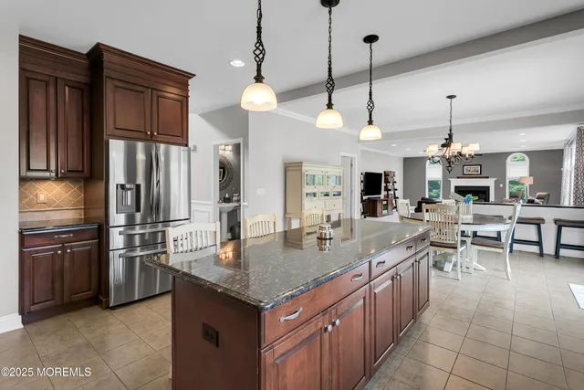 a bathroom with a toilet a sink and a mirror