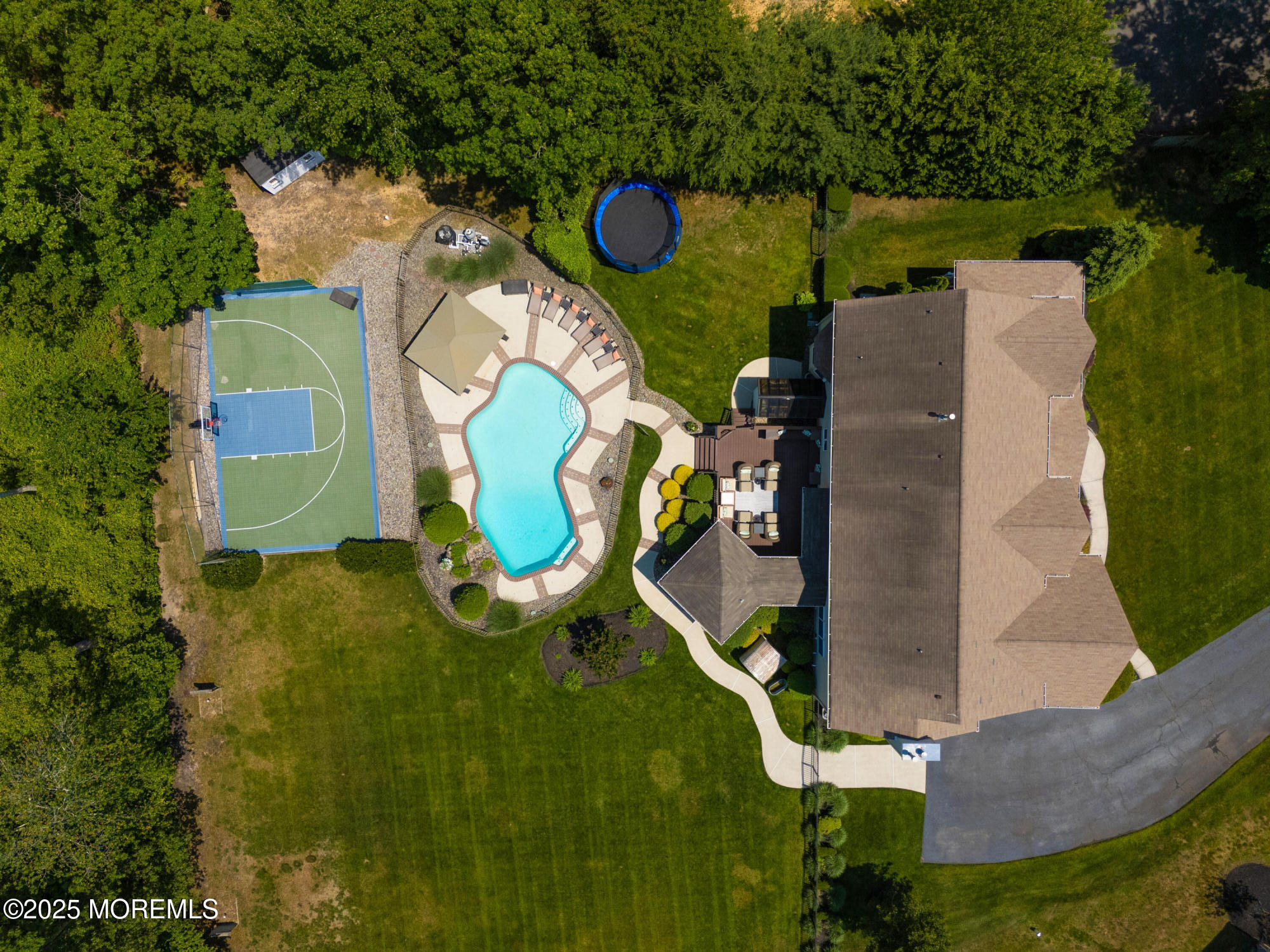 529 Woodview Road Toms River, NJ 08755 - Photo 3 of 85 an aerial view of a house with a swimming pool and outdoor seating