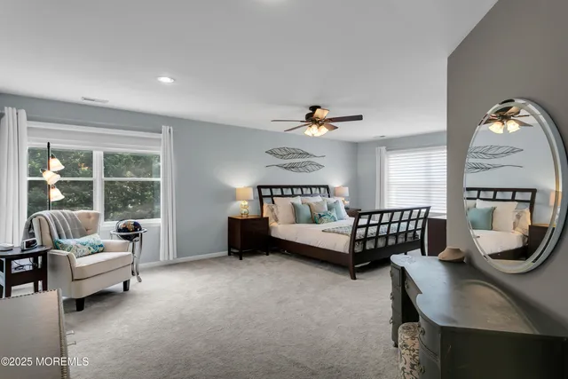 a spacious bathroom with a double vanity sink and a mirror