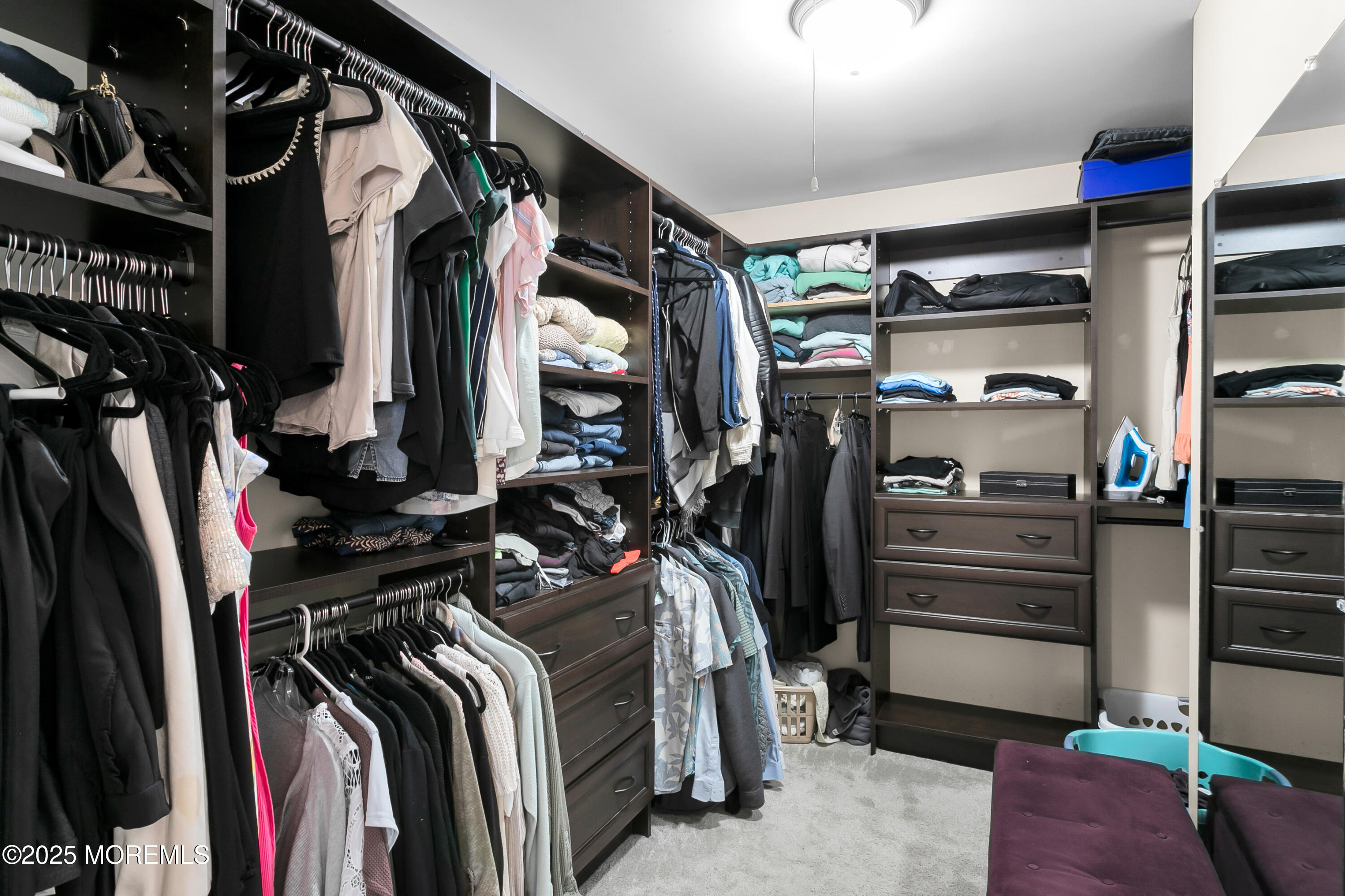 529 Woodview Road Toms River, NJ 08755 - Photo 36 of 85 a view of walk in closet with clothes and shoes