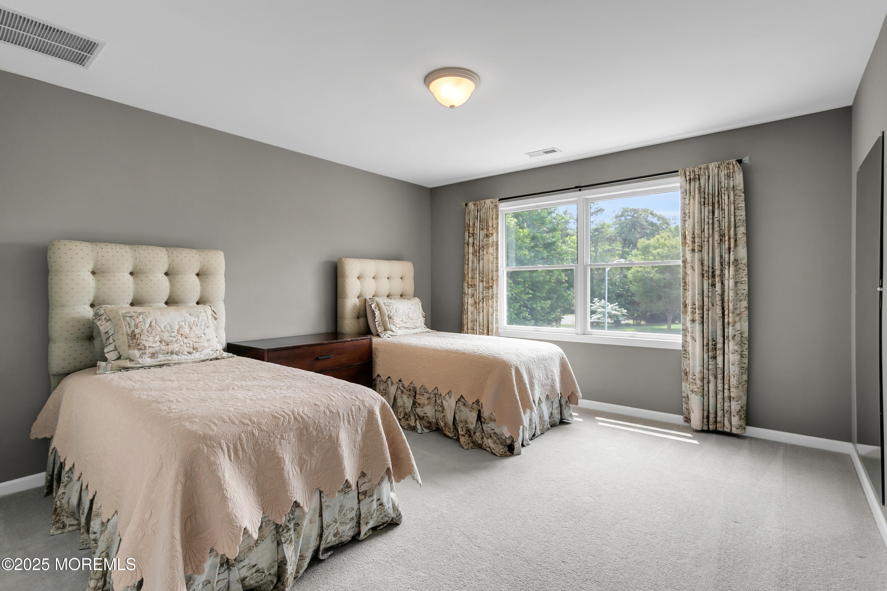 529 Woodview Road Toms River, NJ 08755 - Photo 37 of 85 a bedroom with two beds and a large window