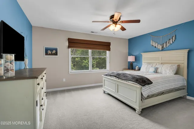 a view of a patio with couches chairs and wooden floor