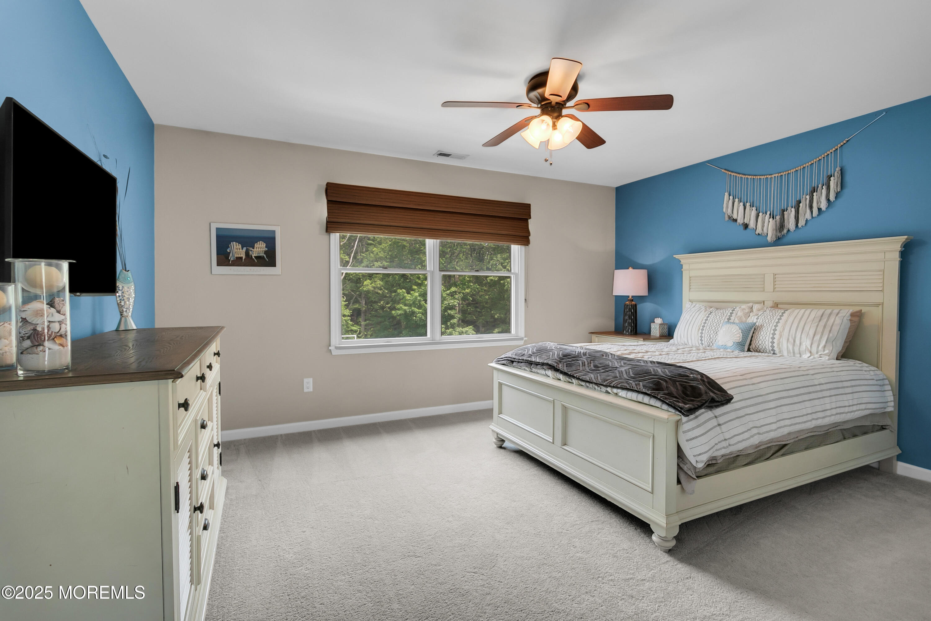 529 Woodview Road Toms River, NJ 08755 - Photo 38 of 85 a bedroom with a bed and a flat screen tv