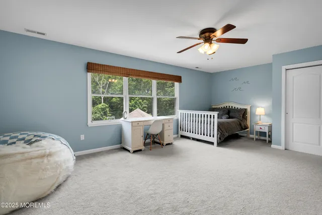 a view of a swimming pool with lawn chairs under an umbrella